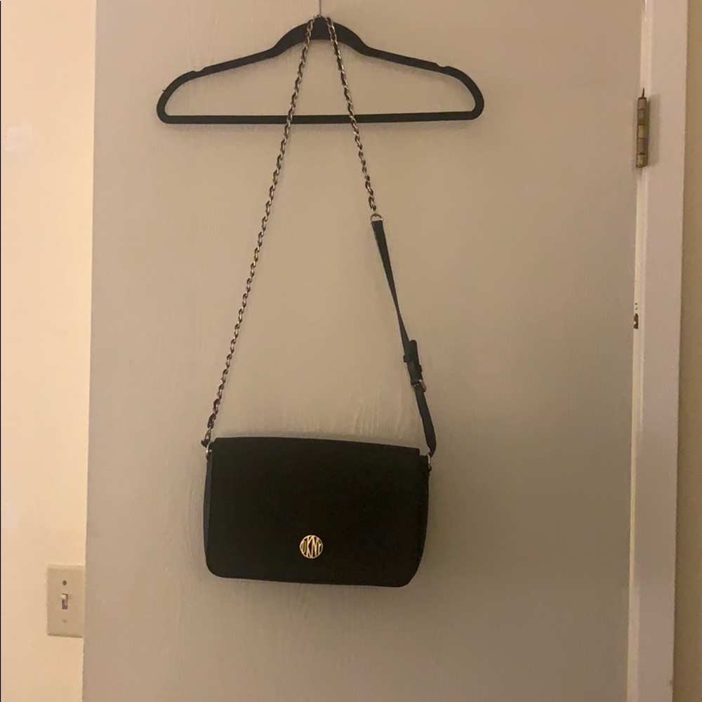 Black DKNY cross body purse.